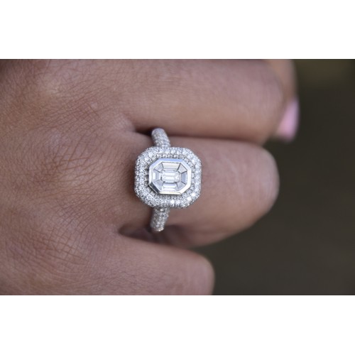 252 - DIAMOND RING 18CT WHITE GOLD CENTRE SET WITH BAGUETTE CUT DIAMONDS IN CUSHION SHAPE SURROUND PAVE SE... 