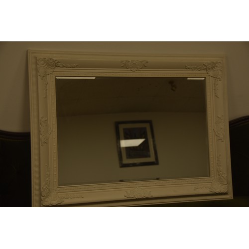 262 - BEVELLED EDGED MIRROR WITH ORNATE WHITE FRAME OVERALL MEASURING 45