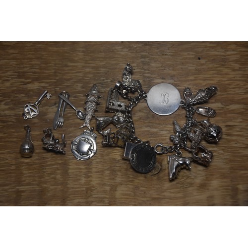 231A - HEAVY SILVER BRACELET WITH EXTRA CHARMS