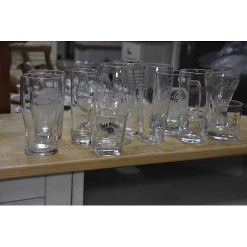 28 - LARGE QTY OF MIXED GLASSWARE INCLUDING GUINNESS, COKE ETC