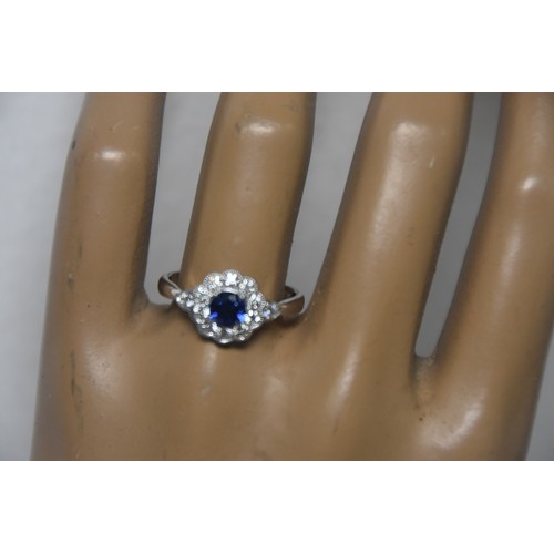 240A - 18ct SAPPHIRE AND DIAMOND CLUSTER RING SIZE N IN WHITE GOLD