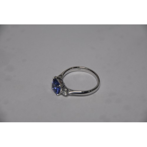 253A - 3 STONE TANZANITE AND DIAMOND RING SET IN 18 ct WHITE GOLD SIZE N