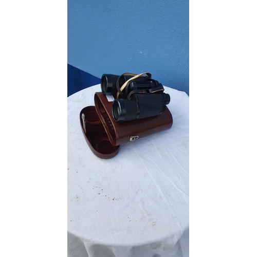 116 - A SET OF LEATHER CASED  BINOCULARS