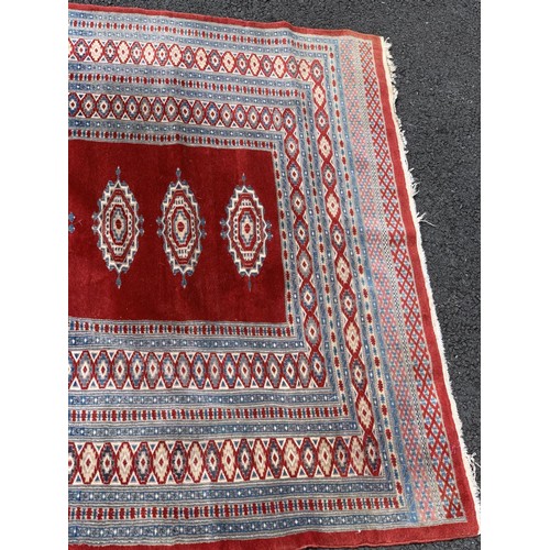 23 - A RED PATTERNED RUG 75X50