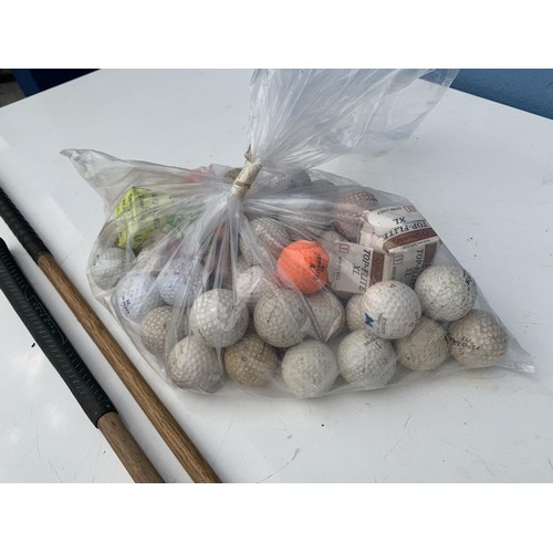 140 - 2 ANTIQUE GOLF PUTTERS & LOT OF GOLF BALLS