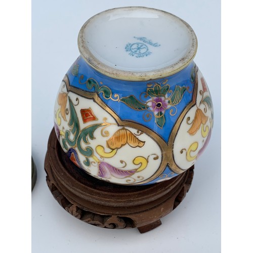 249 - AN OLD HAND PAINTED NORITAKE JAR AND LID ON STAND