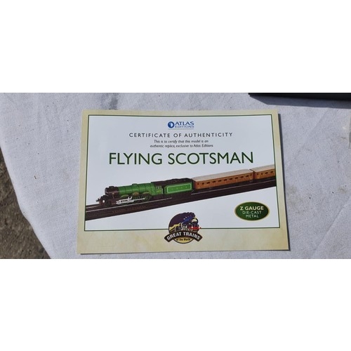 265 - A BOXED MINI DIE CAST MODEL OF THE FLYING SCOTSMAN