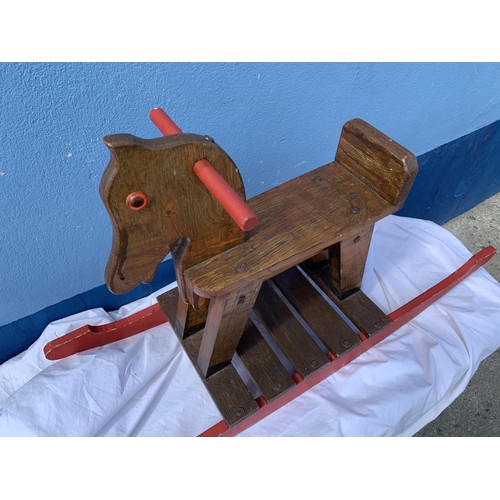 307 - AN OLD WOODEN ROCKING HORSE