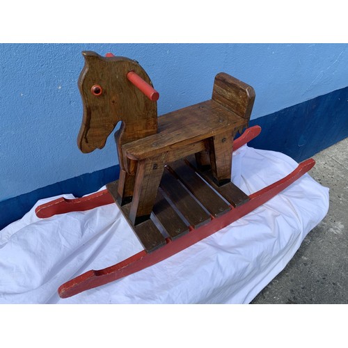 307 - AN OLD WOODEN ROCKING HORSE