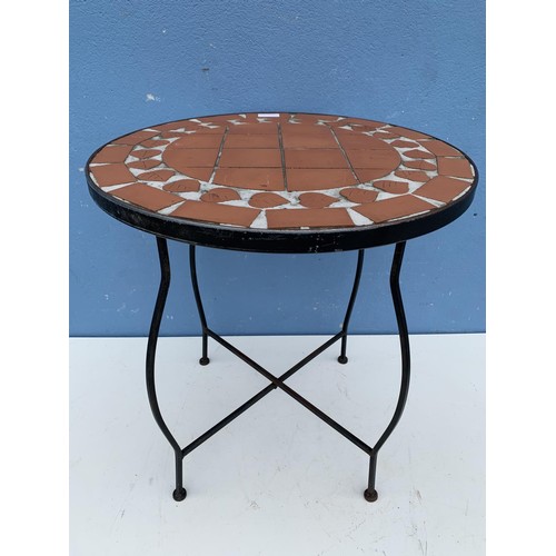 31 - A TILED TOP TABLE ON A CAST BASE