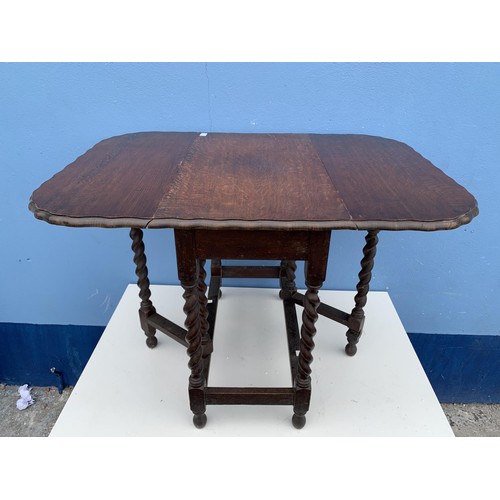 87 - A SOLID OAK BARLEY TWIST DROP LEAF TABLE