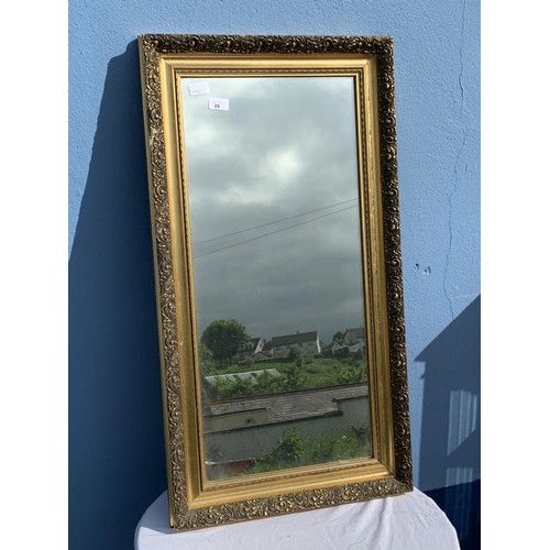 93 - A GILT FRAMED MIRROR 19.5X36