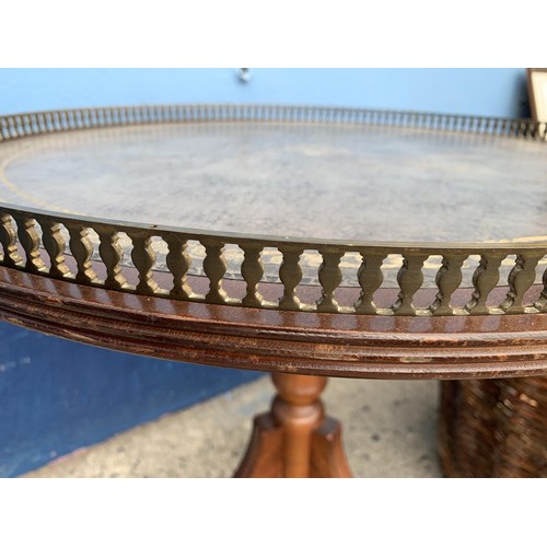 110 - A ROUND LEATHER TOP PEDESTAL TABLE WITH BRASS GALLERY