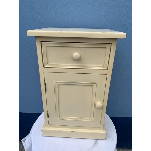 52 - A STRESSED CREAM BEDSIDE WITH DRAWER