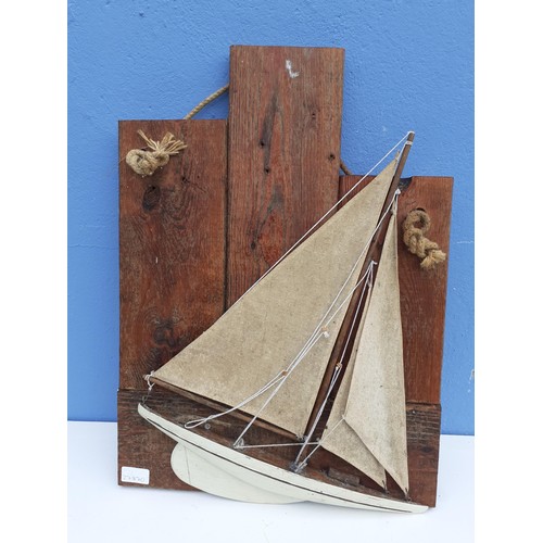 1A - A MODEL SHIP ON A WALL PLAQUE