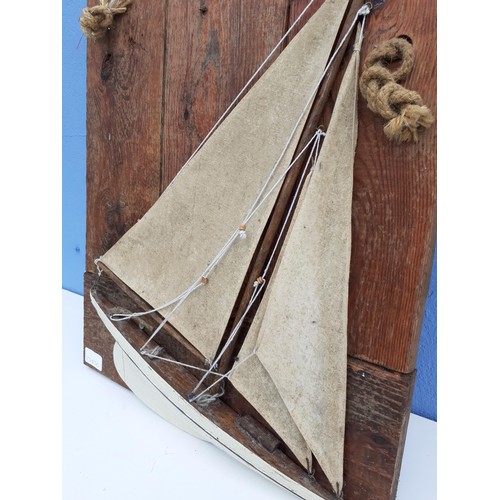 1A - A MODEL SHIP ON A WALL PLAQUE