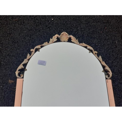 71 - ORNATE COPPER GLASS MIRROR WITH A SHELL MOTIF MEASURES 44 x 17