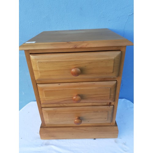 81 - A PINE 3 DRAWER BEDSIDE