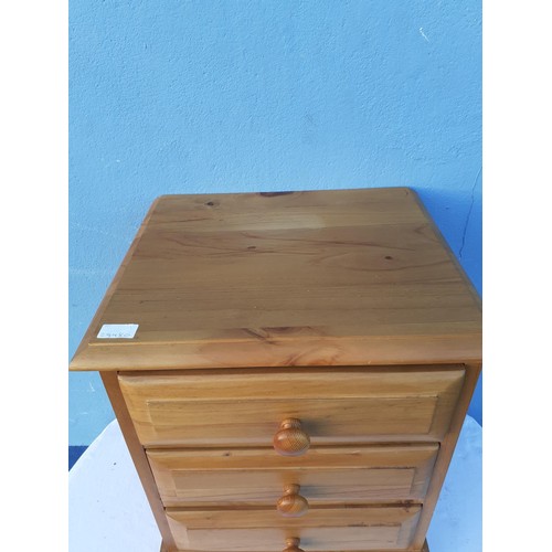 81 - A PINE 3 DRAWER BEDSIDE