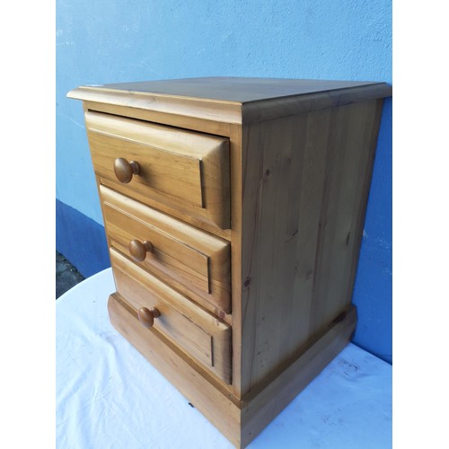 81 - A PINE 3 DRAWER BEDSIDE