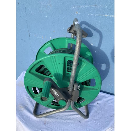 166 - A GARDEN HOSE ON REEL