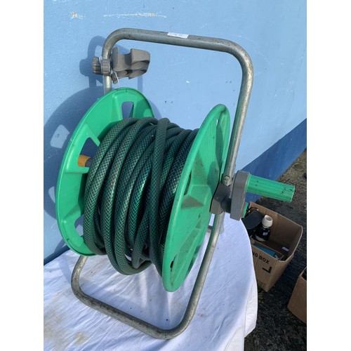 166 - A GARDEN HOSE ON REEL