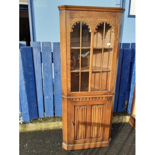 169 - AN OLD CHARM OAK CORNER UNIT WITH LINEN FOLD PANELS