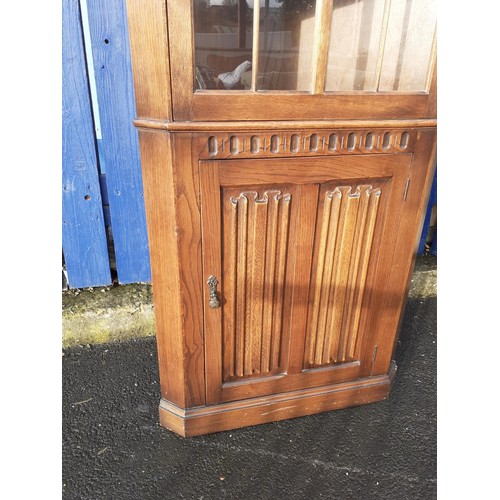 169 - AN OLD CHARM OAK CORNER UNIT WITH LINEN FOLD PANELS