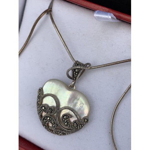 218 - SILVER MOUNTED MAP AND MARCASITE HEART PENDANT ON SILVER CHAIN