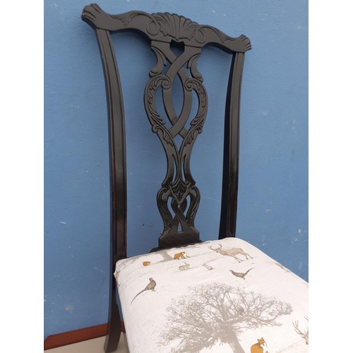 21 - AN EBONISED CHIPPENDALE STYLE CHAIR ON BALL AND CLAW FOOT