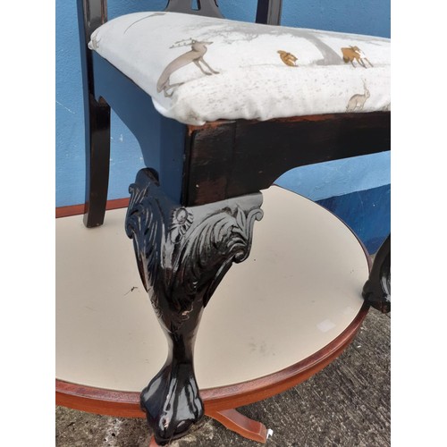 21 - AN EBONISED CHIPPENDALE STYLE CHAIR ON BALL AND CLAW FOOT