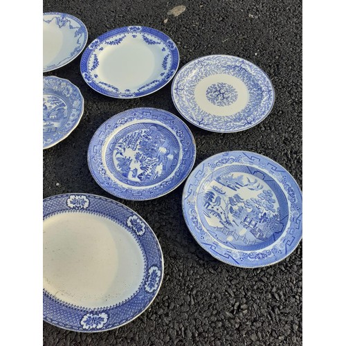 42 - A COLLECTION OF OLD BLUE AND WHITE PLATES