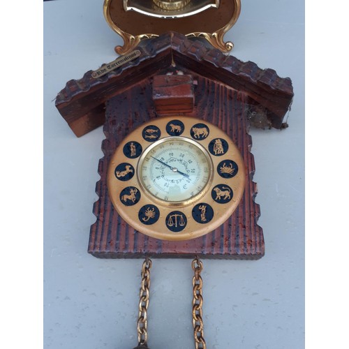 125 - A MANTLE CLOCK ANDN THERMOMETER