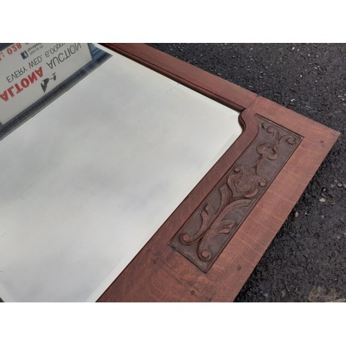 145 - A CARVED FRAMED BEVELL EDGE MIRROR 51X32