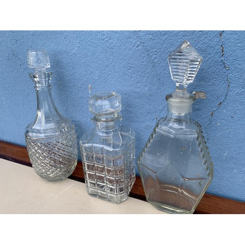 149 - 3 CUT GLASS DECANTERS