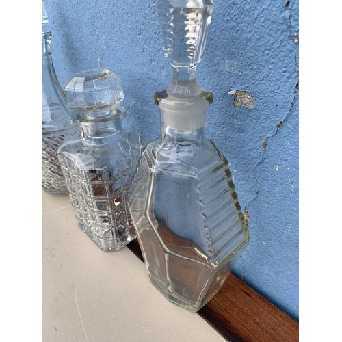149 - 3 CUT GLASS DECANTERS