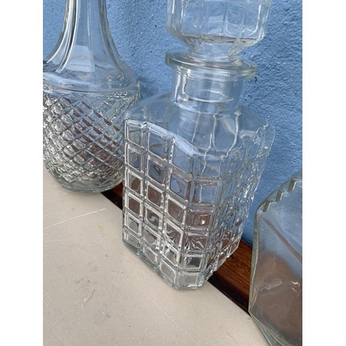 149 - 3 CUT GLASS DECANTERS