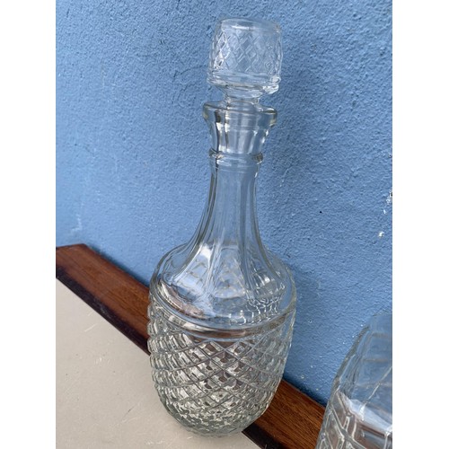 149 - 3 CUT GLASS DECANTERS