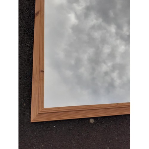 176 - A LARGE PINE FRAMED MIRROR 52X40