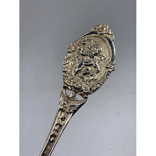 215 - VERY ORNATE SILVER SPOON WITH A CHERUB TO HANDLE 78.6G