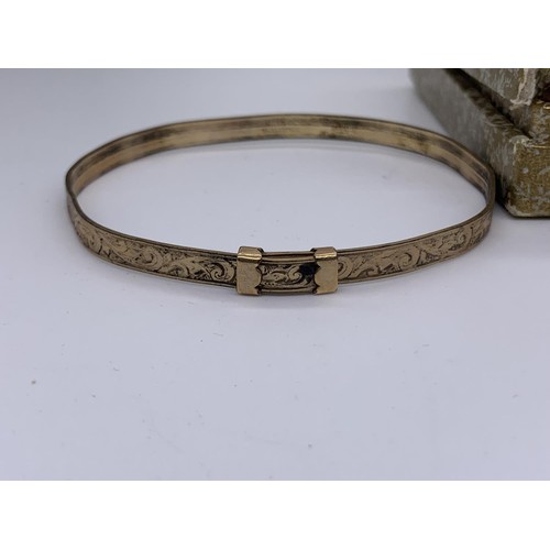 237 - A 9ct ROLLED GOLD BANGLE