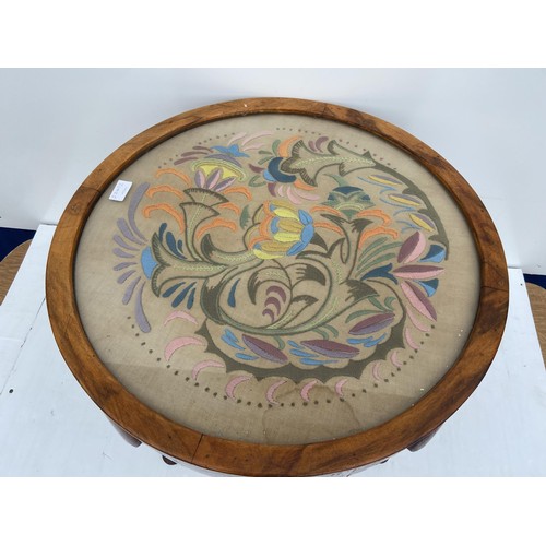 55 - A MAHOGANY  CIRCULAR TABLE WITH A TAPESTRY SET UNDER GLASS TOP