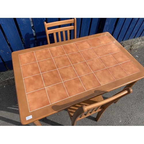 59 - A TILED TOP DINING TABLE AND 2 CHAIRS IN BEECH FINISH SOME MARKS