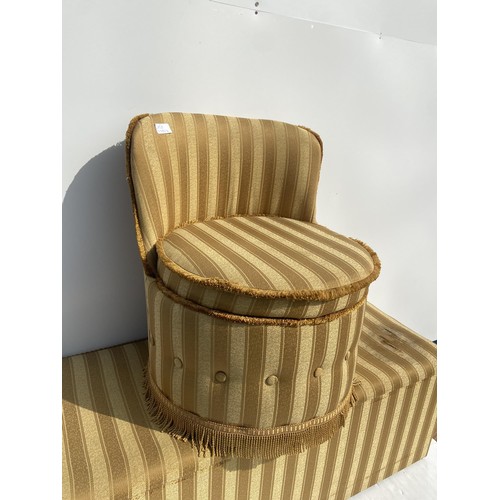 60 - A MATCHING OTTOMAN AND BEDSIDE CHAIR