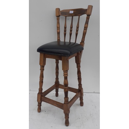 94 - AN OAK AND RED LEATHER HIGH CHAIR