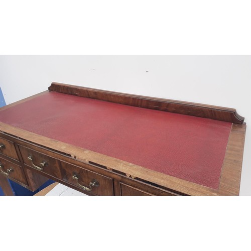 97 - A LEATHER TOPPED WRITING DESK ON CABRIOLE LEG