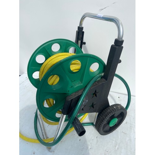 140 - GARDEN HOSE ON REEL