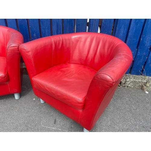 135 - A PAIR OF RED LEATHER TUB CHAIRS