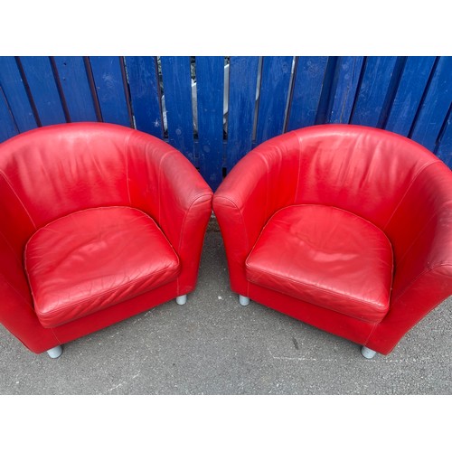 135 - A PAIR OF RED LEATHER TUB CHAIRS