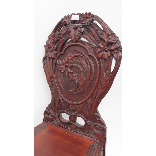 302 - A HEAVILY CARVED ORIENTAL STYLE SIDECHAIR